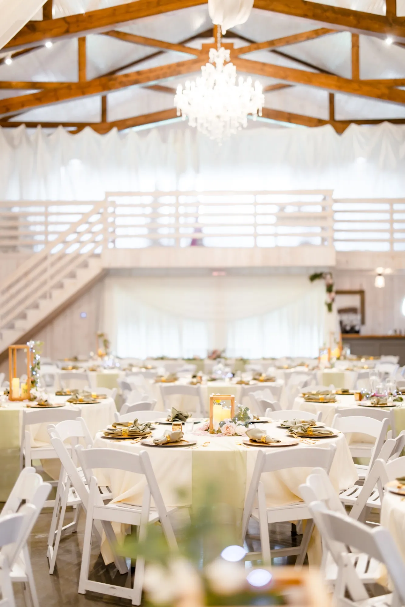 Reception lighting inside the barn at Abram Farms