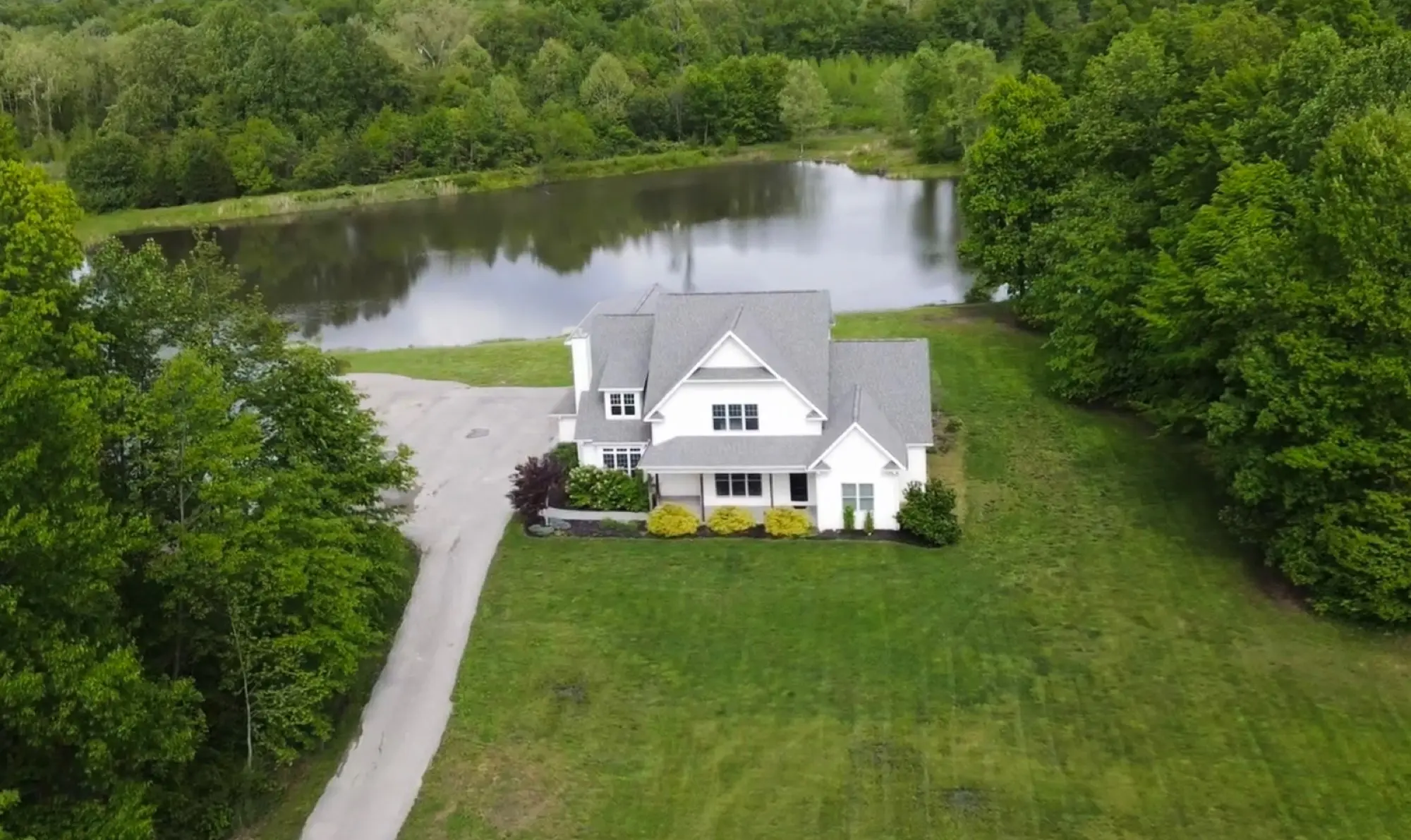 Aerial view of the fields, pond, and Lakeside Manor at Abram Farms