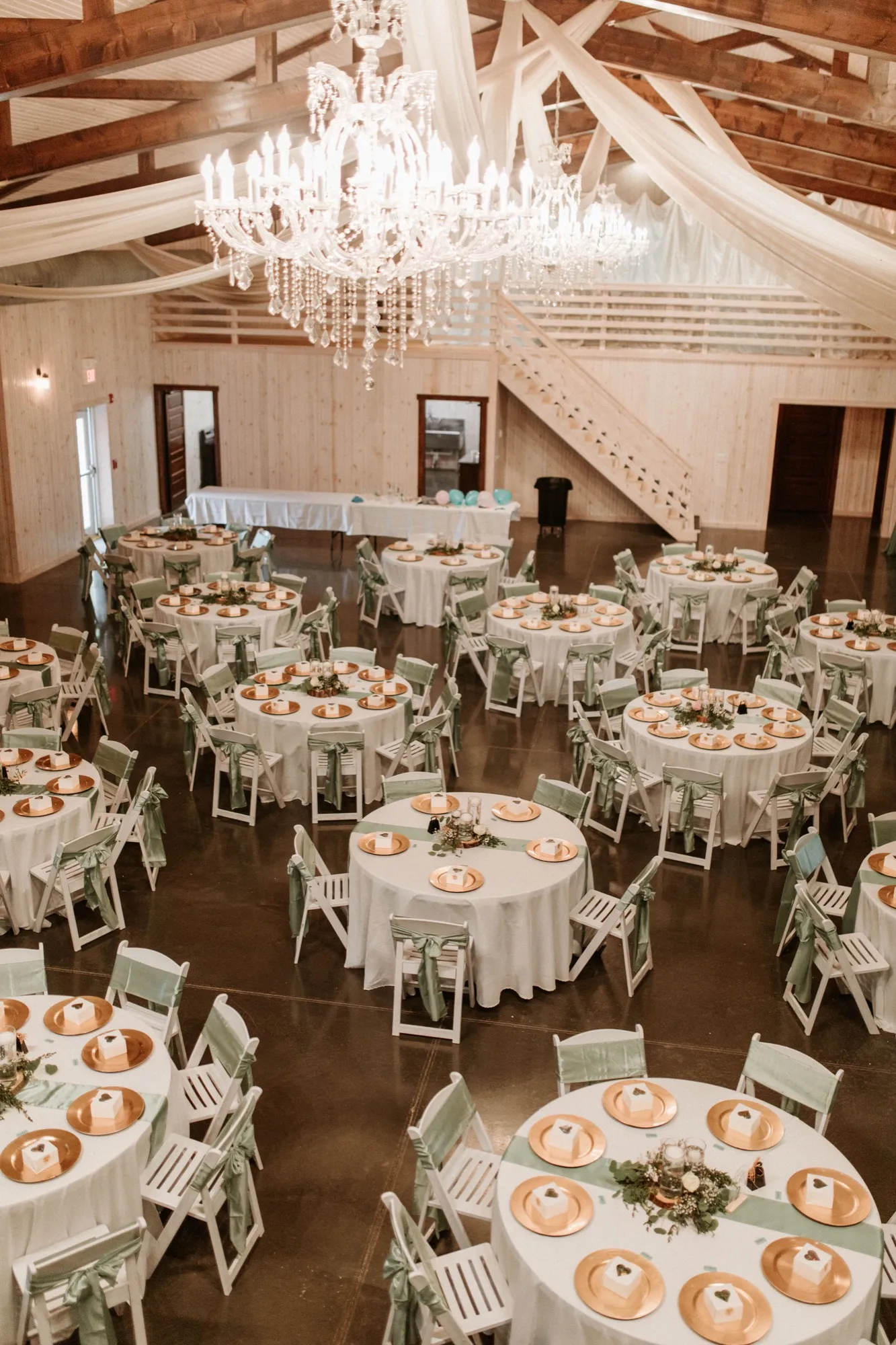 Indoor barn reception tables at Abram Farms