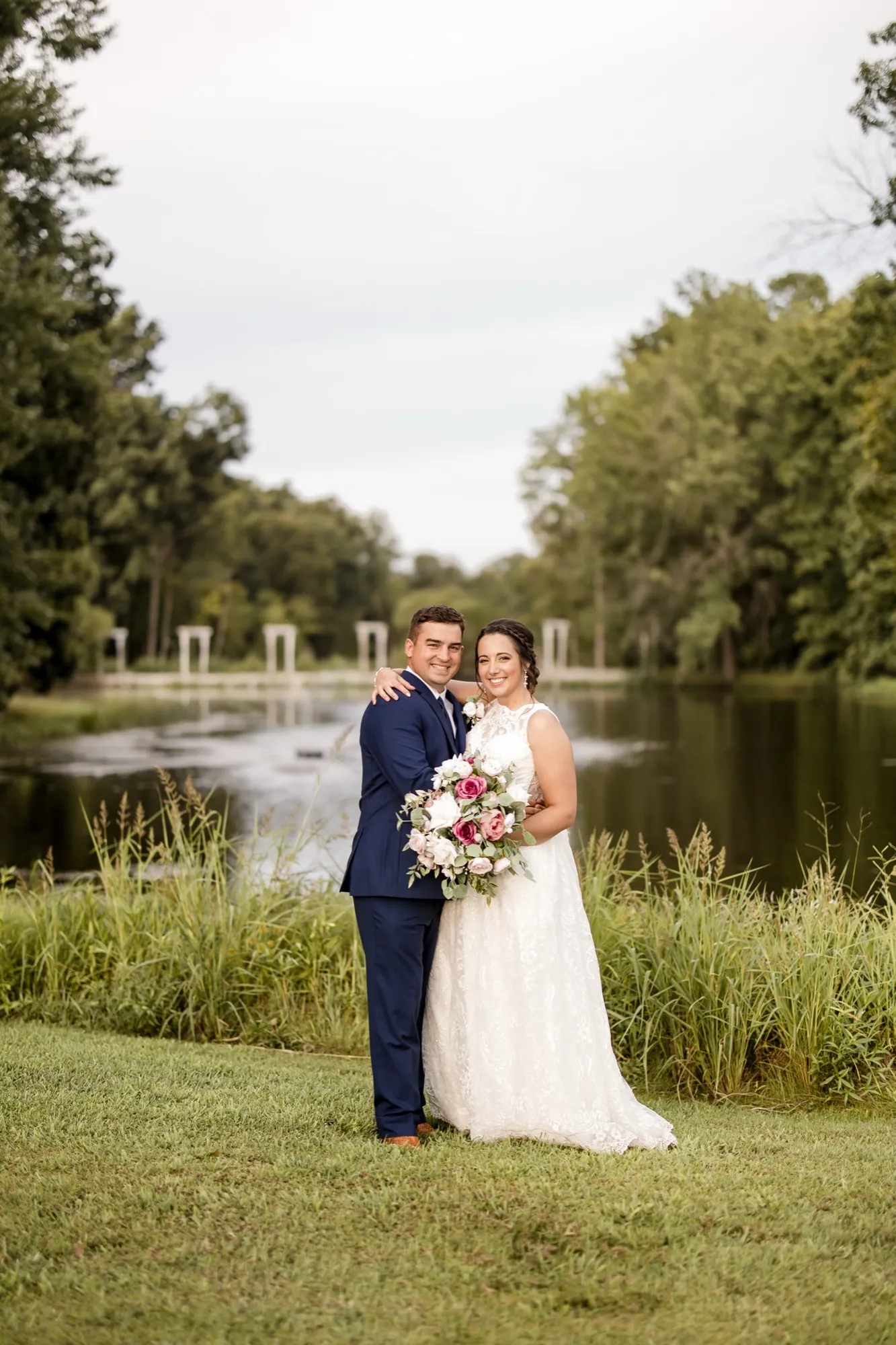 Couple at the pond’s edge at Abram Farms