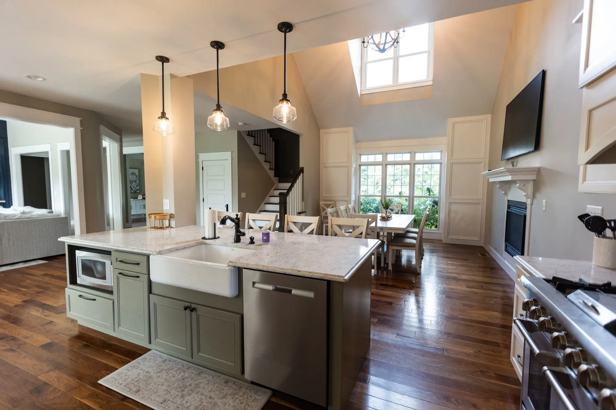 Open kitchen at Lakeside Manor with staircase to the second floor